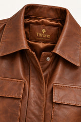 Close-up of the Sarajevo antique brown leather jacket, showing collar, buttons and leather texture