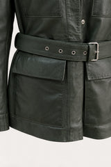 Close-up of the Sofia forest green leather jacket, showing belt, pockets and leather texture
