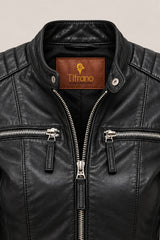 Close-up of the Buenos Aires black leather jacket, showing stand collar, quilted shoulders, silver zippers and leather texture