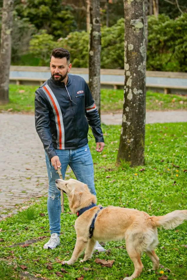 New York men's leather jacket outdoor lifestyle shot, model with dog in park, racing stripe design