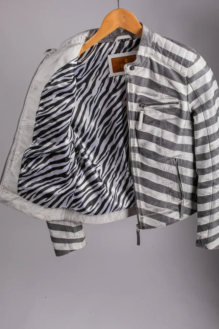 Nairobi striped leather jacket open on hanger revealing zebra-print lining, interior detail shot