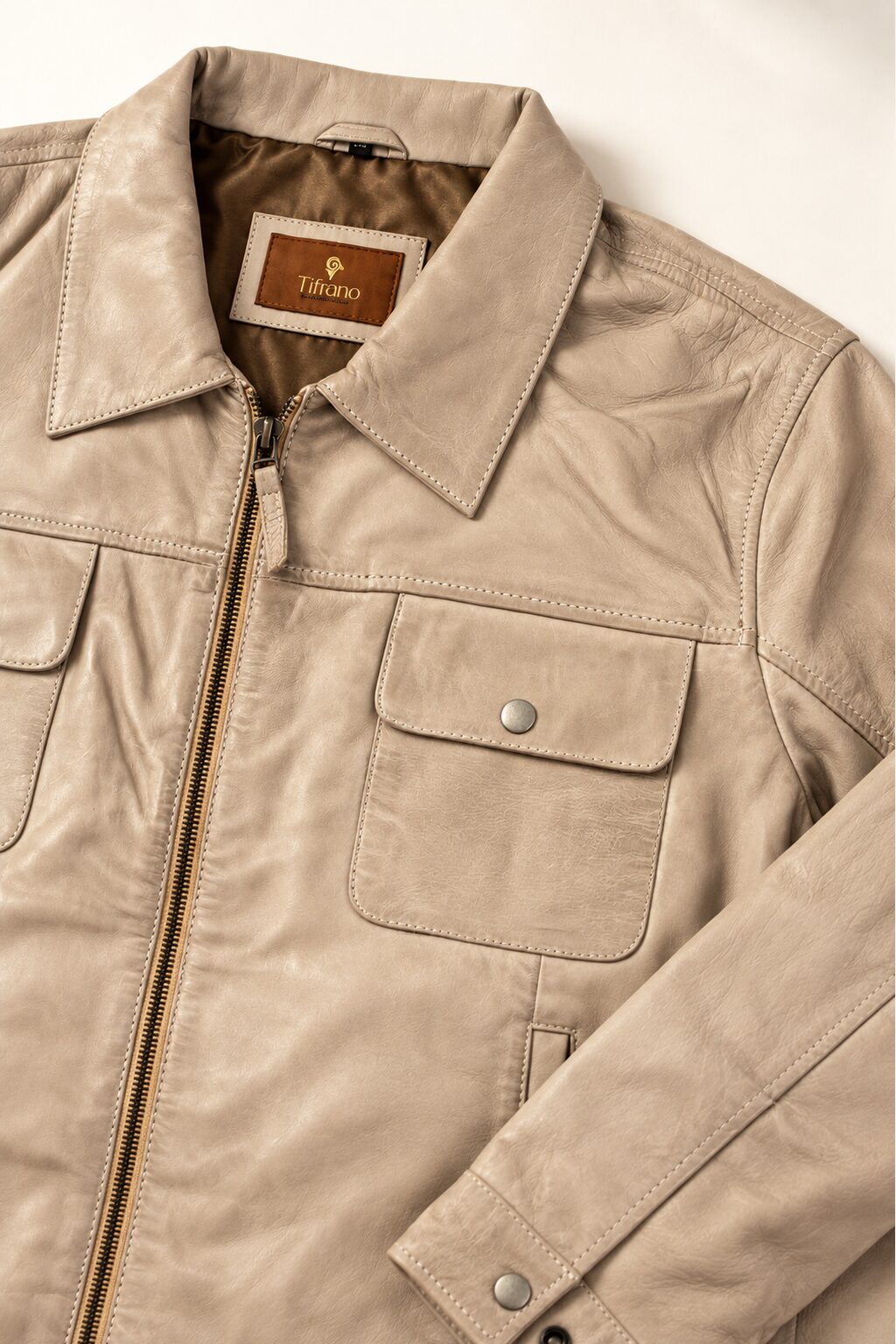 Close-up detail of the Tifrano Baku cream leather jacket collar, pocket and label