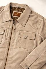 Close-up detail of the Tifrano Baku cream leather jacket collar, pocket and label