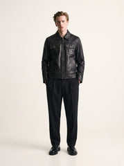 Man wearing the Budapest black leather trucker jacket, full-body front view