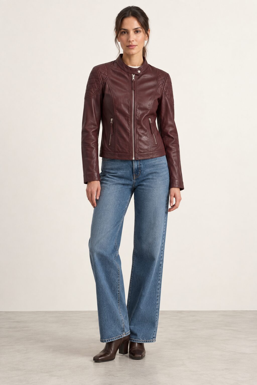 Woman wearing the Bursa burgundy leather jacket, full-body front view