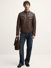 Man wearing the Copenhague dark brown leather racer jacket, full-body front view