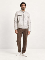 Man wearing the Helsinki white distressed leather jacket, full-body front view