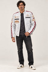 Man in sunglasses wearing the Tifrano MB dirty white leather biker jacket, full-body front view with dark jeans and sneakers