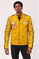 Man modeling the Tifrano MB yellow leather jacket, front three-quarter view showing racing patches and zip pockets