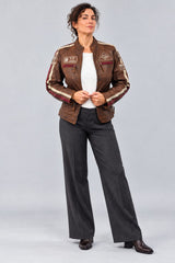 Woman wearing the antique brown leather biker jacket, full-body front view