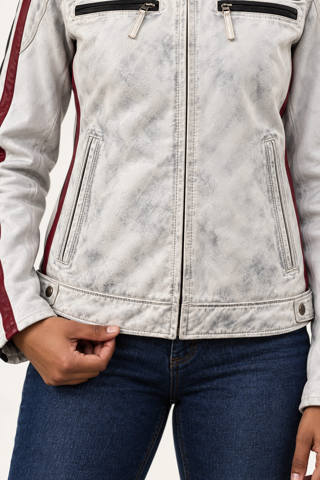 Close-up of the Tifrano MB dirty white leather jacket showing the distressed finish, front zip pockets, and burgundy side stripe