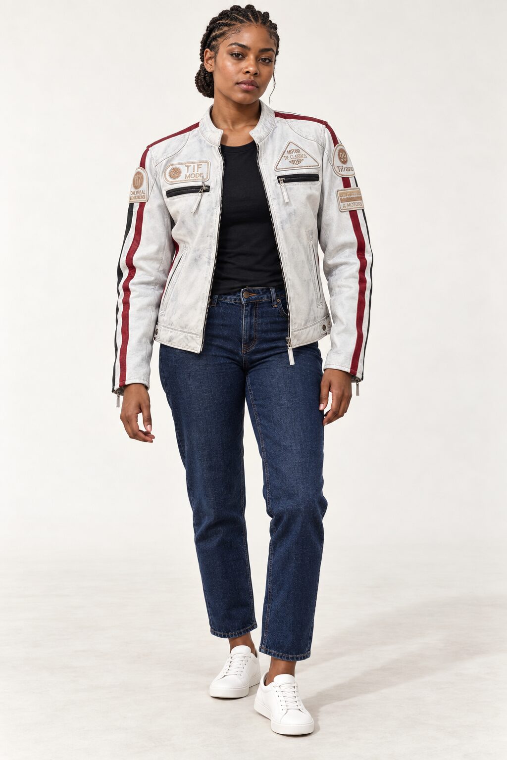 Full-body front view of a woman wearing the Tifrano MB dirty white leather biker jacket with jeans and white sneakers