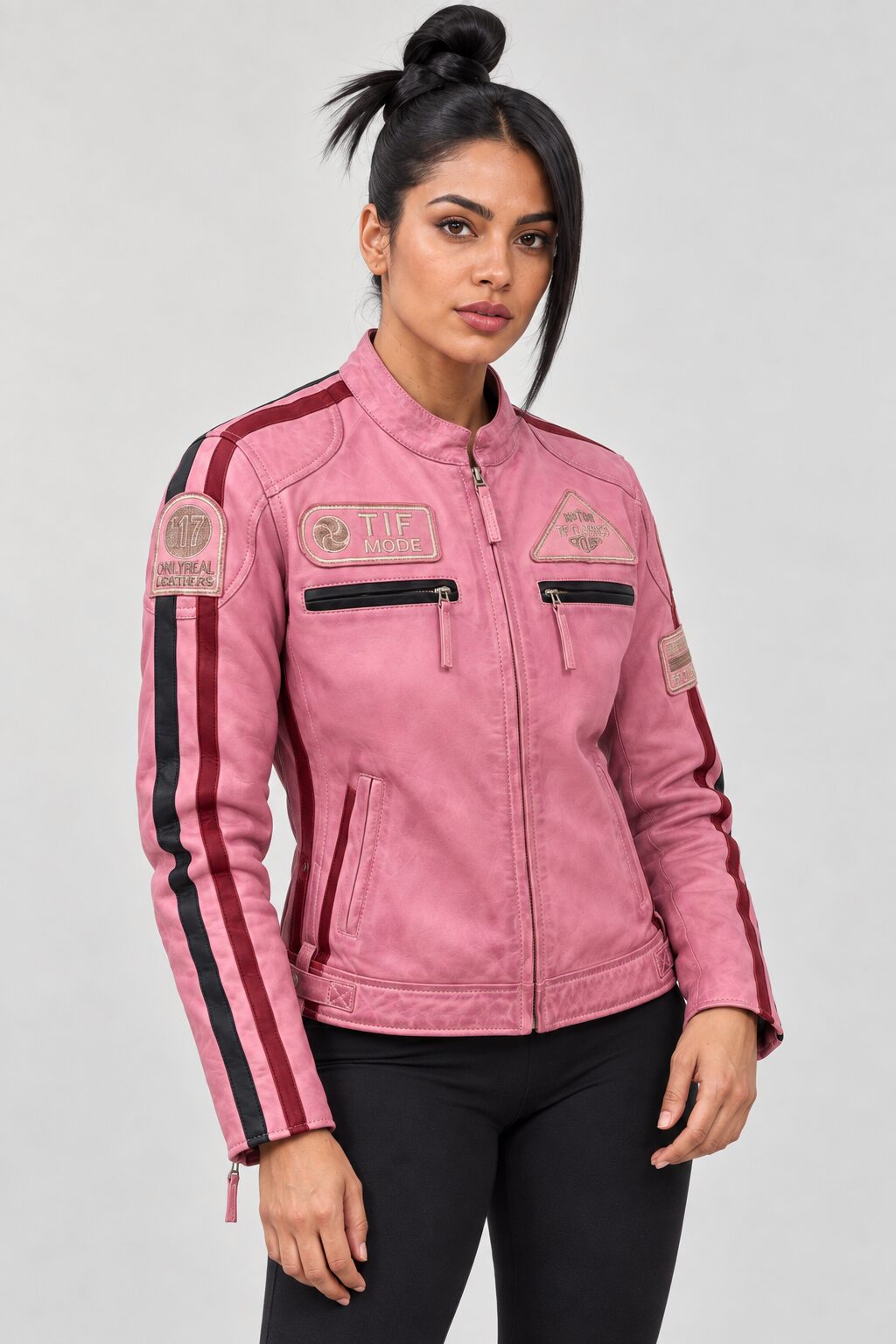 Woman wearing the pink leather biker jacket with patches, three-quarter view