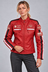 Woman wearing the red leather biker jacket with patches, three-quarter view