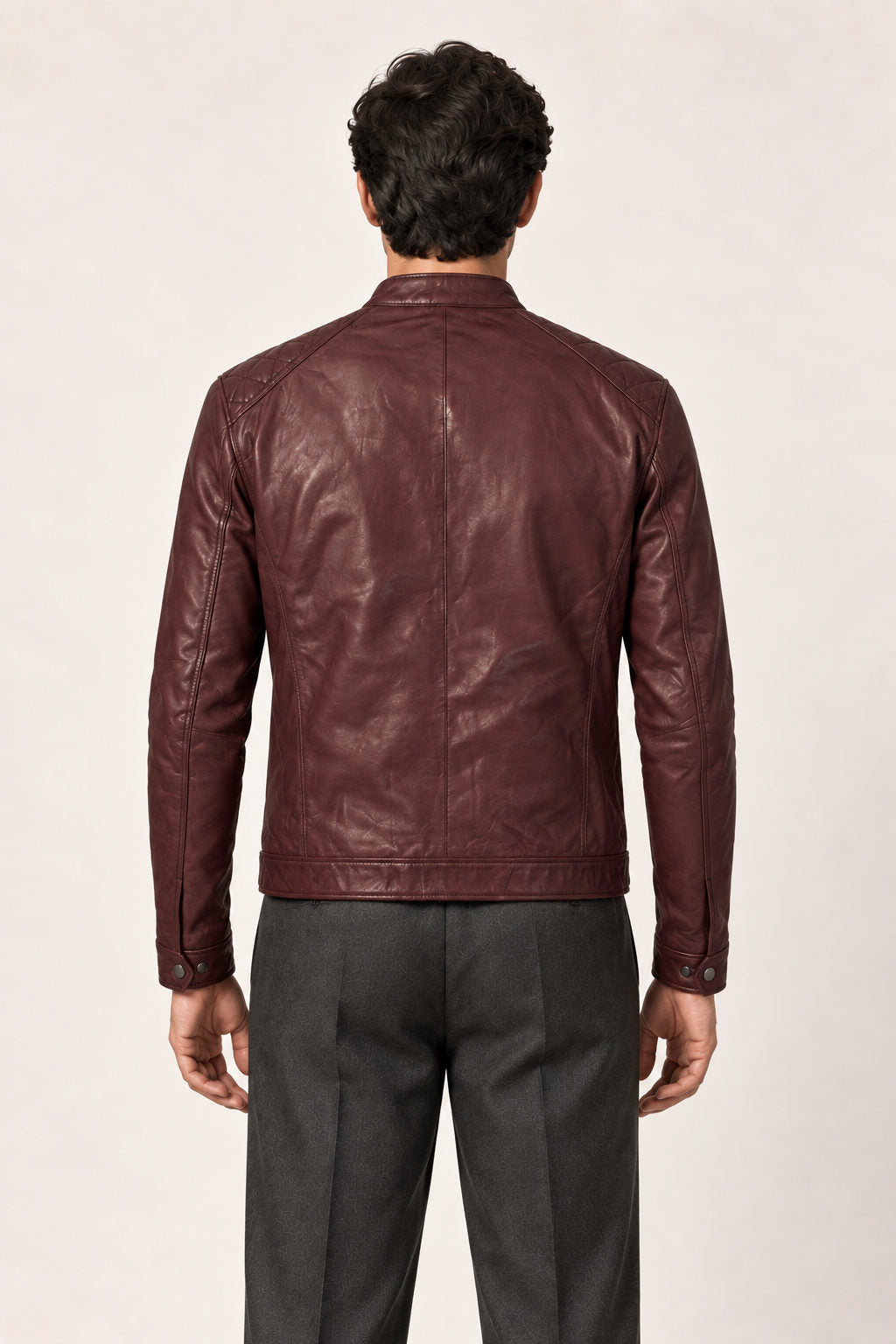 Back view of a man wearing the Tifrano Prague burgundy leather jacket, showing the back seams and shoulder panels.