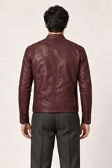 Back view of a man wearing the Tifrano Prague burgundy leather jacket, showing the back seams and shoulder panels.