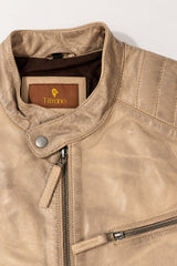 Close-up of the Toledo beige leather jacket with quilted panels, stand collar and zippers