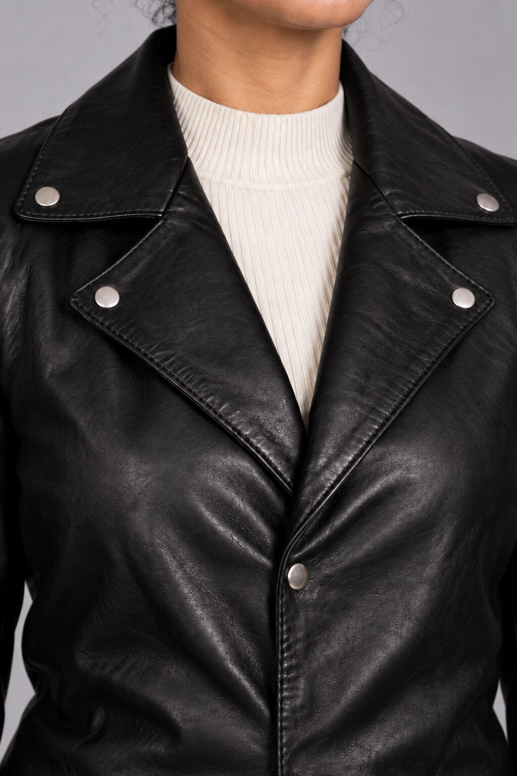 Close-up detail of the Ushuaia black leather coat