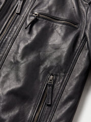 Close-up detail of the Viena black leather racer jacket