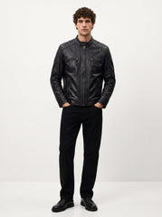 Man wearing the Viena black leather racer jacket, full-body front view