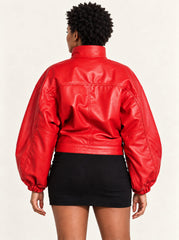 Close-up detail of the Vulkan red leather jacket with puff sleeves