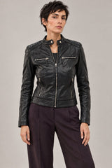 Woman wearing the Buenos Aires black leather jacket with quilted shoulders and zip pockets, front view