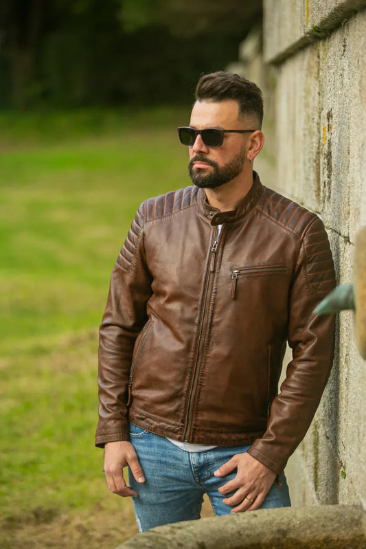 Madrid men's brown leather jacket outdoor lifestyle shot on male model against stone wall