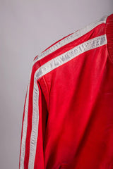 Roma red leather jacket close-up detail shot of silver stripe on shoulder seam, flat lay on hanger
