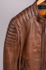 Madrid brown leather jacket close-up of quilted shoulder panel and Tifrano label on hanger