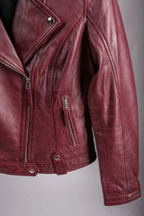 Shiraz women's leather jacket close-up of asymmetric zip, lapel collar and chest pocket in burgundy