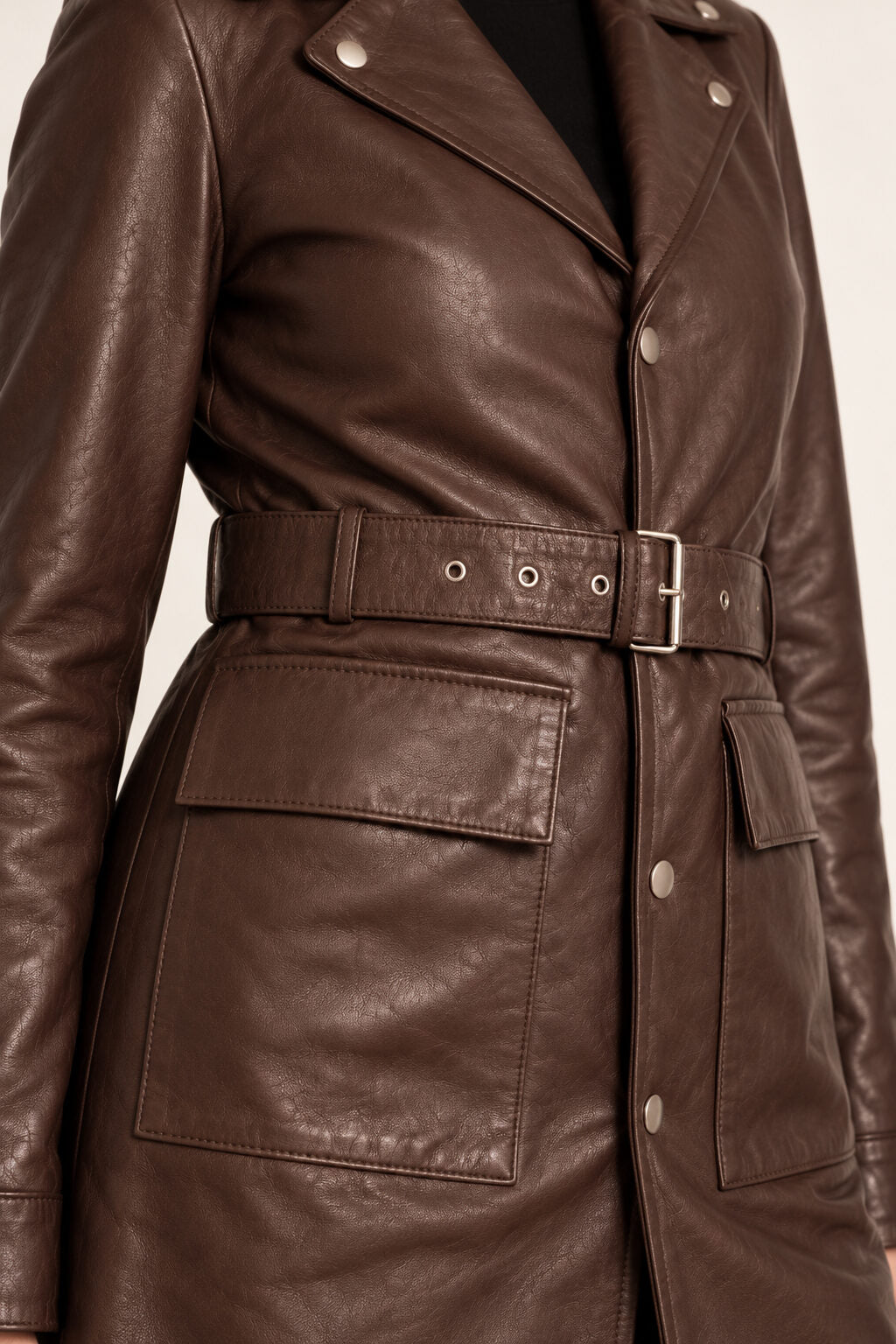 Close-up detail of the Bariloche dark brown leather coat