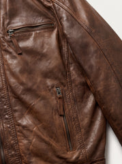 Close-up detail of the Brujas cognac leather racer jacket