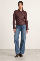 Woman wearing the Bursa burgundy leather jacket, full-body front view