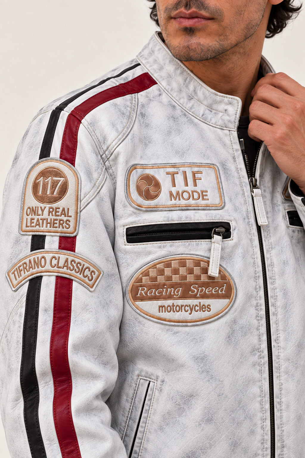 Close-up of the Tifrano MB dirty white leather jacket showing the distressed finish, Racing Speed patch, and front zip pocket