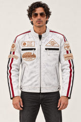 Man modeling the Tifrano MB dirty white leather jacket, front three-quarter view showing racing patches and zip pockets