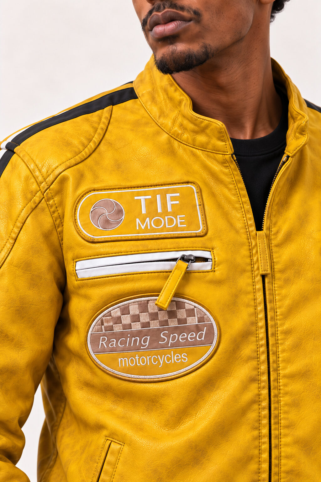 Close-up of the Tifrano MB yellow leather jacket showing the Racing Speed patch and front zip pocket detail