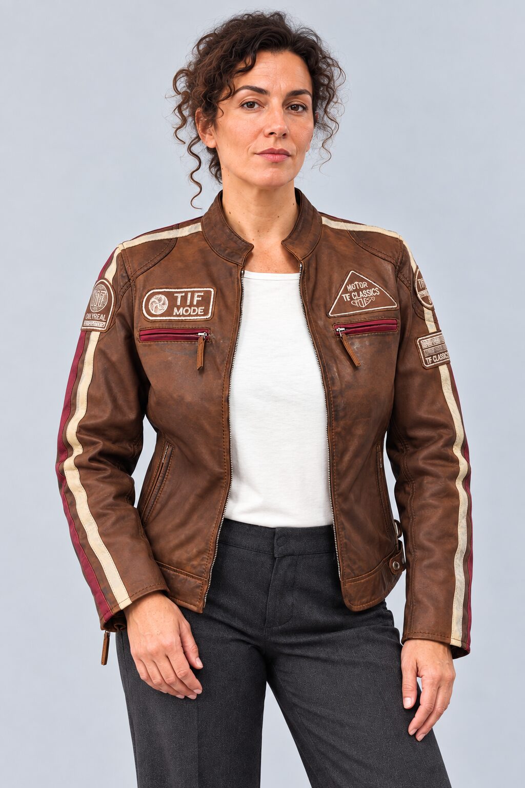 Woman wearing the antique brown leather biker jacket, alternate three-quarter view