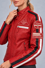 Close-up detail of the red leather biker jacket with patches