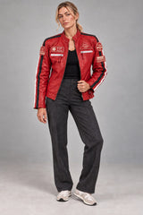 Woman wearing the red leather biker jacket with patches, full-body front view