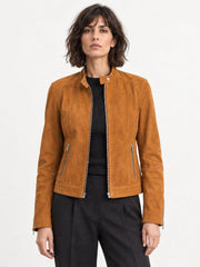 Woman wearing the Minerva camel suede jacket, full-body front view