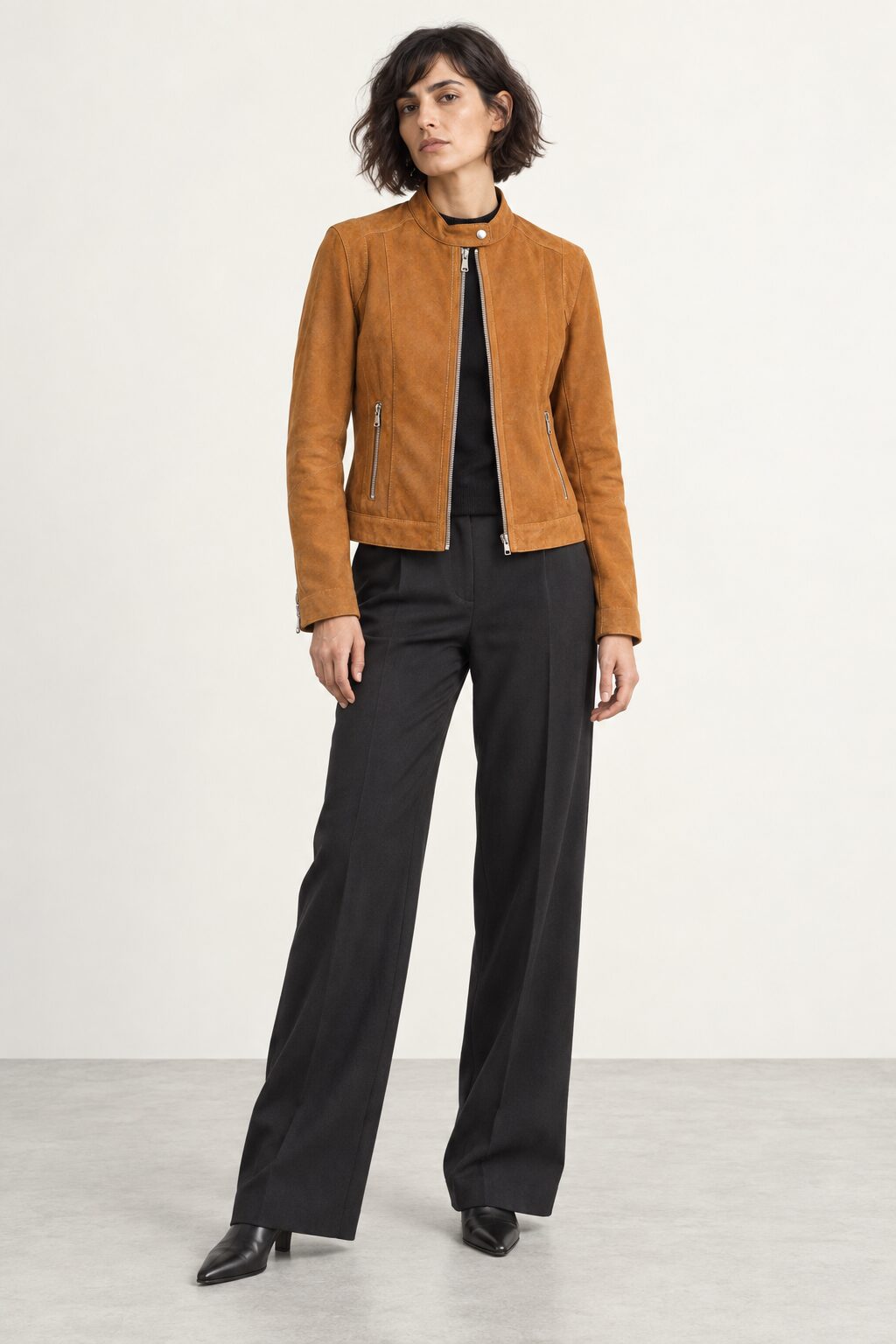 Woman wearing the Minerva camel suede jacket, three-quarter view