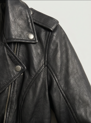Close-up of the Montreal black leather biker jacket - sheep leather texture, snap collar and shoulder epaulette