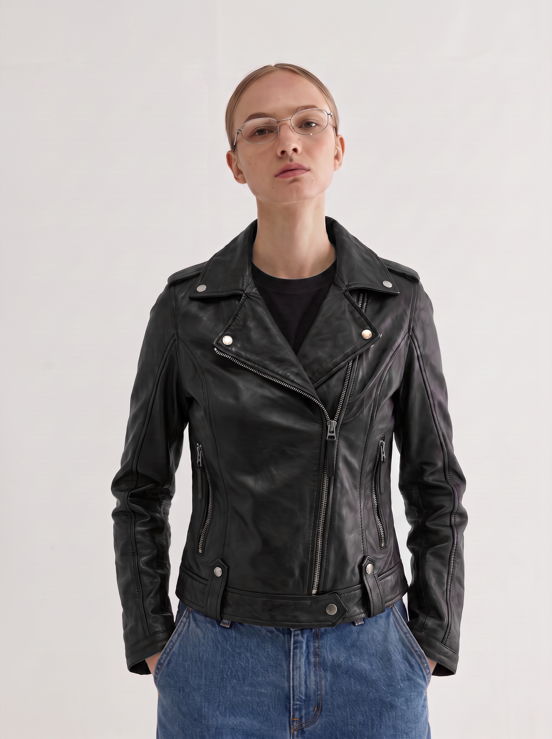 Woman wearing the Montreal black leather biker jacket over a black t-shirt - front view