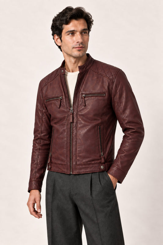 Three-quarter view of a man wearing the Tifrano Prague burgundy leather jacket with quilted shoulders and zipped pockets.