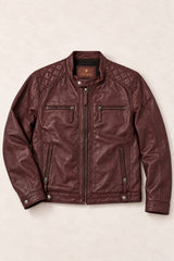 Front view of the Tifrano Prague burgundy leather jacket laid flat, with a snap collar and four zipped pockets.