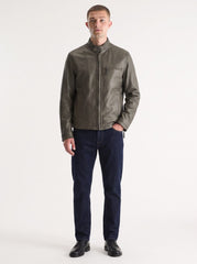 Man wearing the Quebec olive green distressed leather jacket, full-body front view