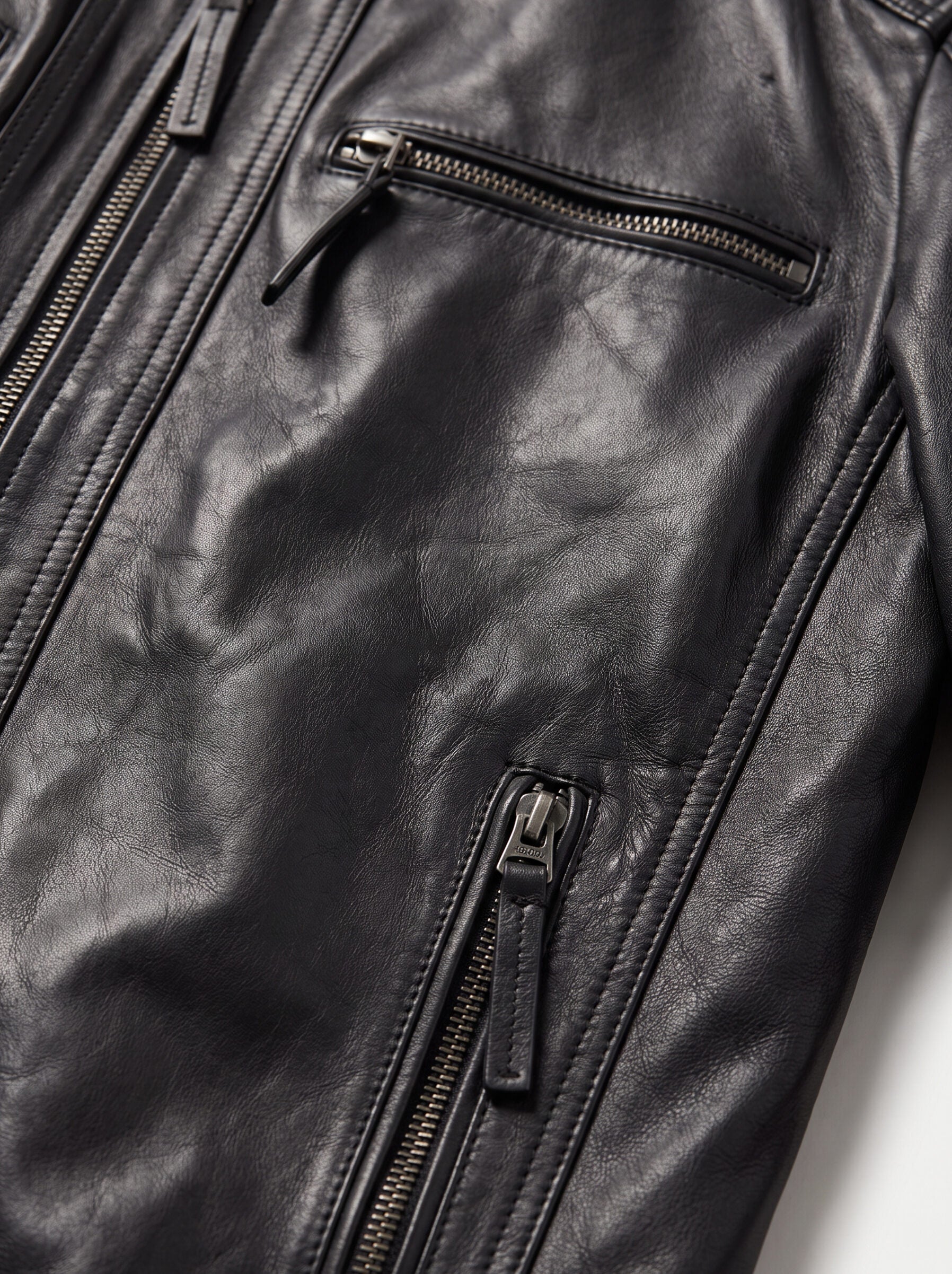 Close-up detail of the Viena black leather racer jacket
