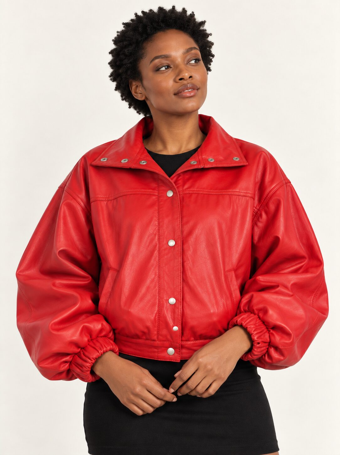 Woman wearing the Vulkan red leather jacket with puff sleeves, second alternate three-quarter view