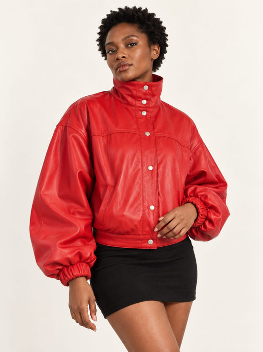 Woman wearing the Vulkan red leather jacket with puff sleeves, alternate three-quarter view